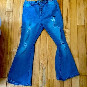 Size Large denim jeans with flared bottom.